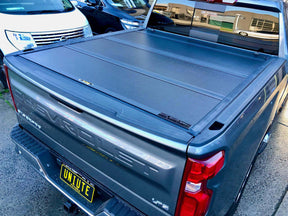 Quad-fold hard lid for Chevrolet Silverado 1500 2014-2026 — installed closed view | UniUte