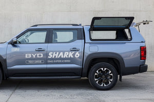 Fibreglass Canopy for BYD Shark 6 shown on a parked 2025+ model in profile view with open canopy window, FORCE PRO series.