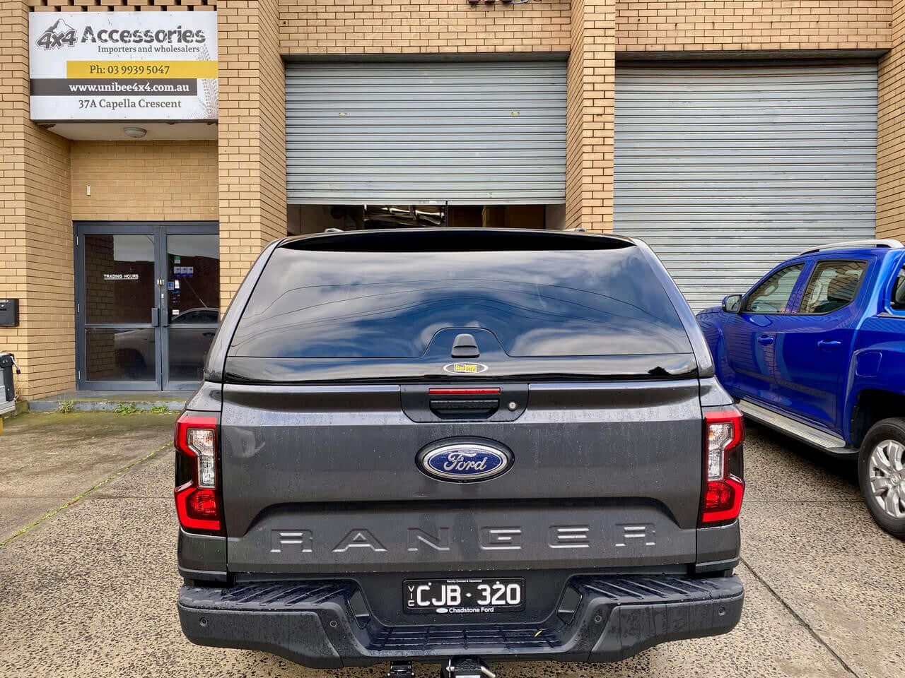Ford Ranger canopy for RA NextGen 2022-2025, parked outside accessories shop