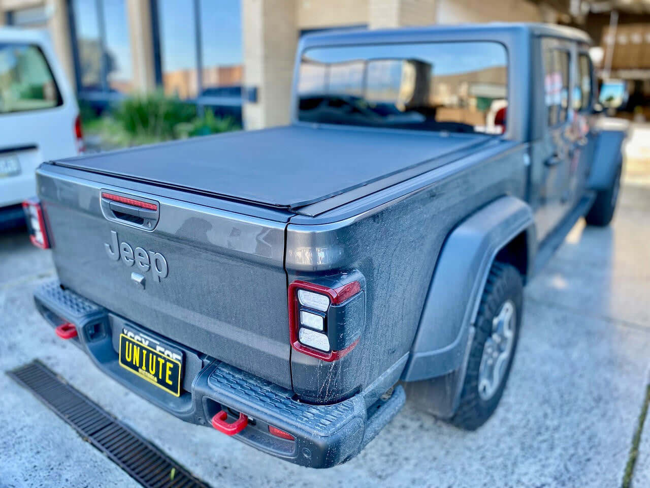 REVOLVER tonneau on Jeep Gladiator — partially rolled showing tub access