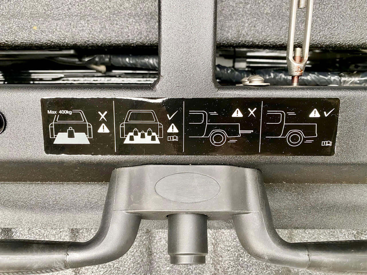 Safety instructions on a ute sliding tray for RAM 1500 5.7' bed, displaying weight capacity and correct usage guidelines.