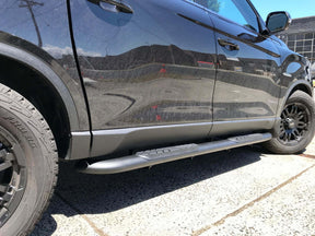 Black side bars for SsangYong Musso 2018-2026 — installed side view | UniUte