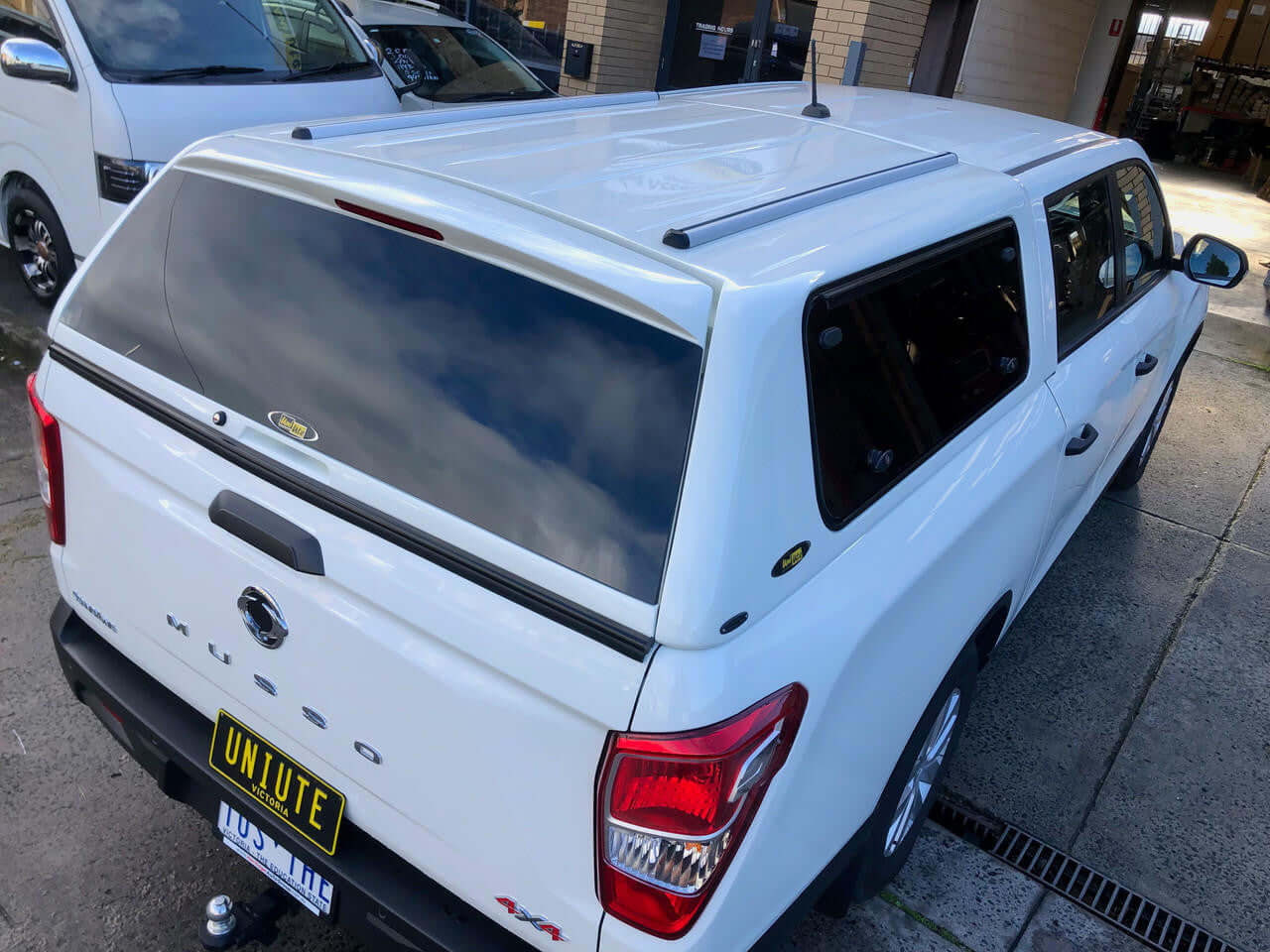 canopy for ssangyong musso XLV long tub 2018-2025, UniUte FORCE PRO, white truck with heavy-duty canopy for work and adventure