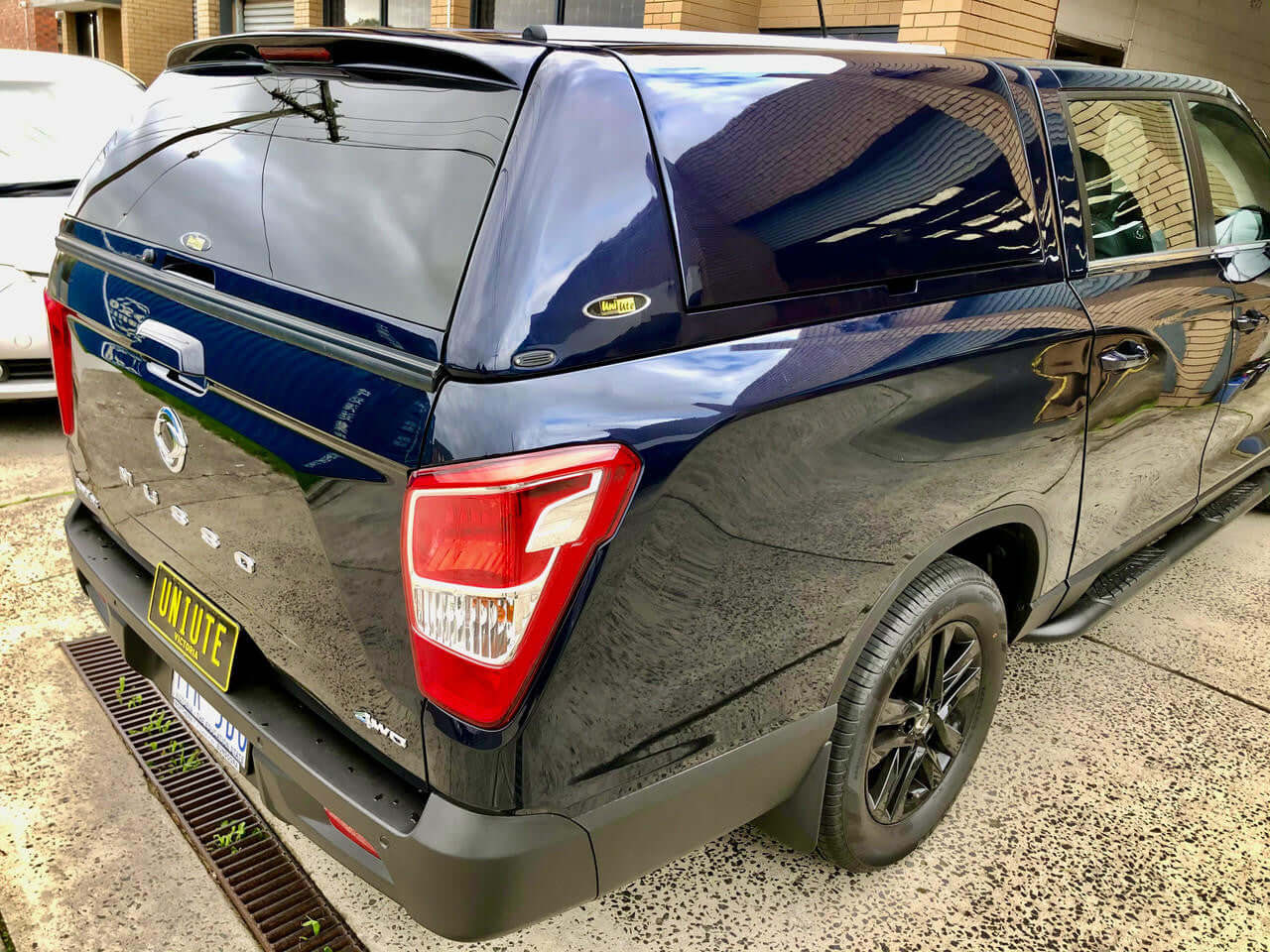 SsangYong Musso XLV Canopy FORCE PRO PLUS 2018-2025 installed on a dark blue pickup truck.