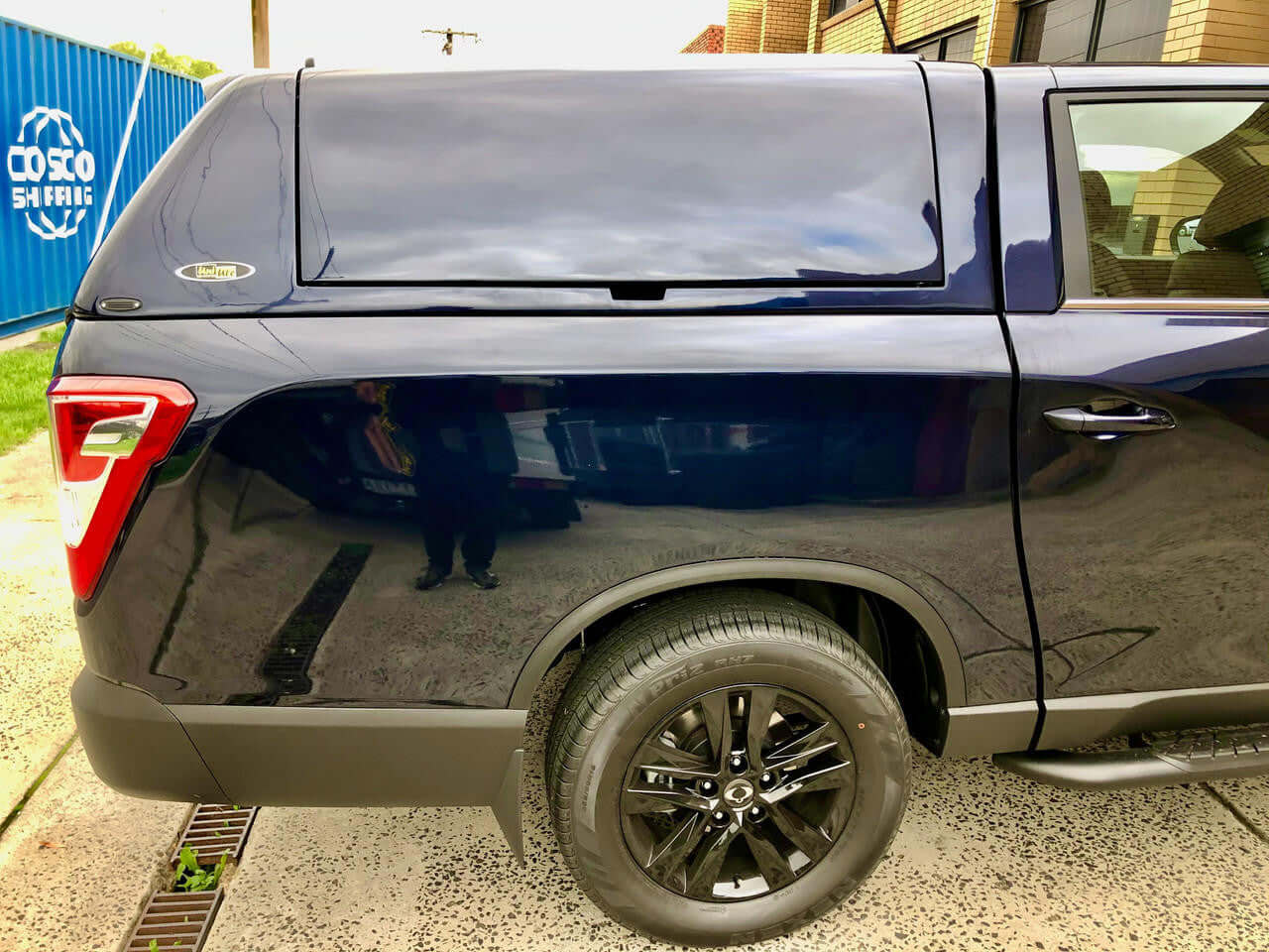 SsangYong Musso XLV Canopy by UniUte FORCE PRO PLUS, black finish on a parked vehicle, showcasing advanced design and utility.
