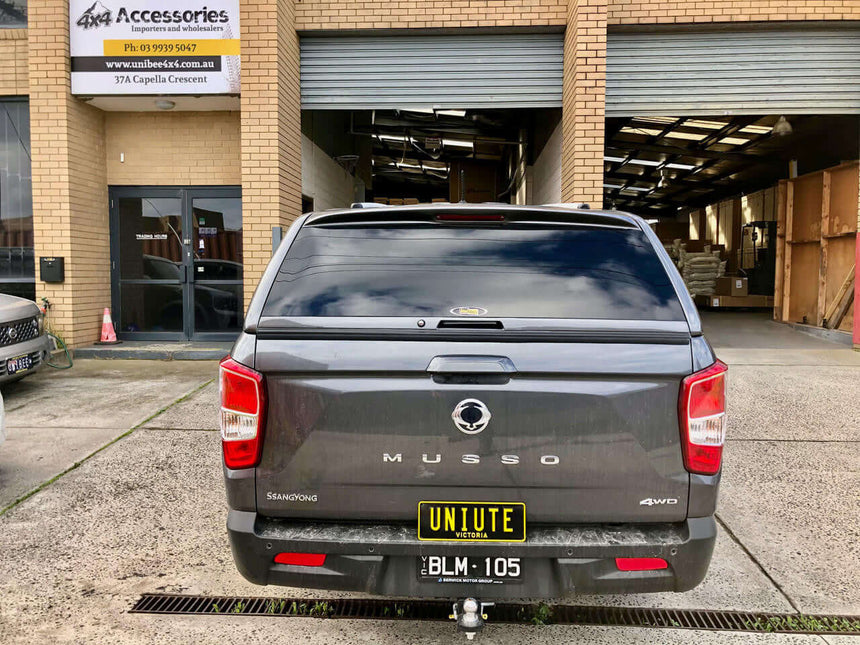 Rear view of SsangYong Musso XLV Canopy at 4x4 accessories store.