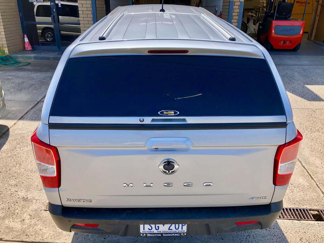 SsangYong Musso XLV Canopy (Long Tub) FORCE PRO PLUS 2018-2025, rear view of silver pickup with UniUte canopy installed
