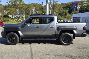 KIA Tasman side steps with black steel bars on a 2025 model for enhanced access and protection