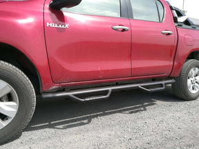 Black HD running boards for Toyota Hilux 2015-2025 — installed side view | UniUte
