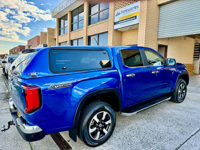 New Volkswagen Amarok canopy parked outside a building, showcasing the amarok canopy for 2023-2025 models.
