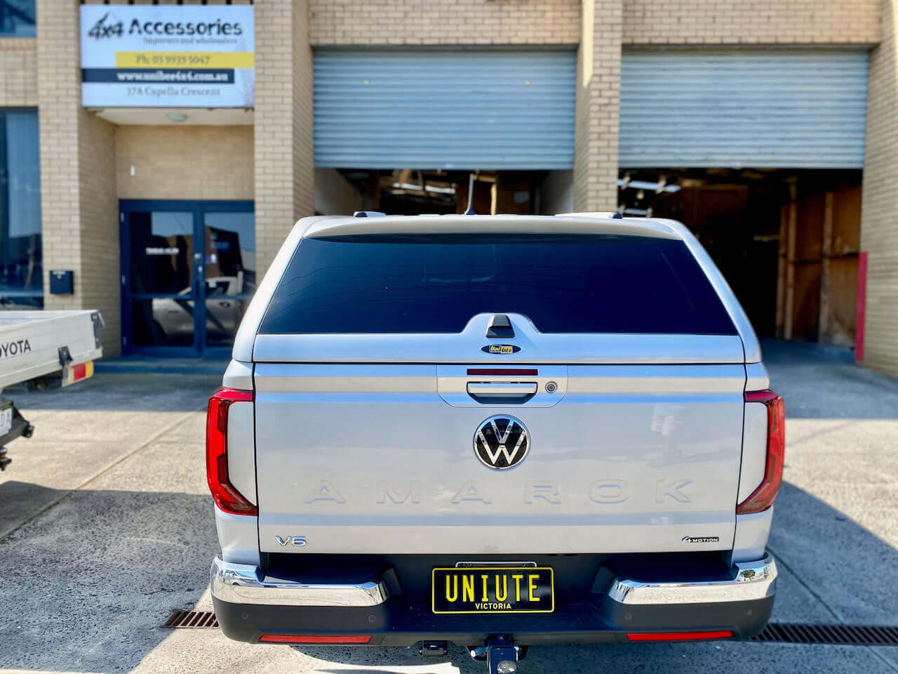 Rear view of a Volkswagen Amarok canopy by UniUte, designed for models 2023-2025. Ideal accessory for Amarok canopy enthusiasts.