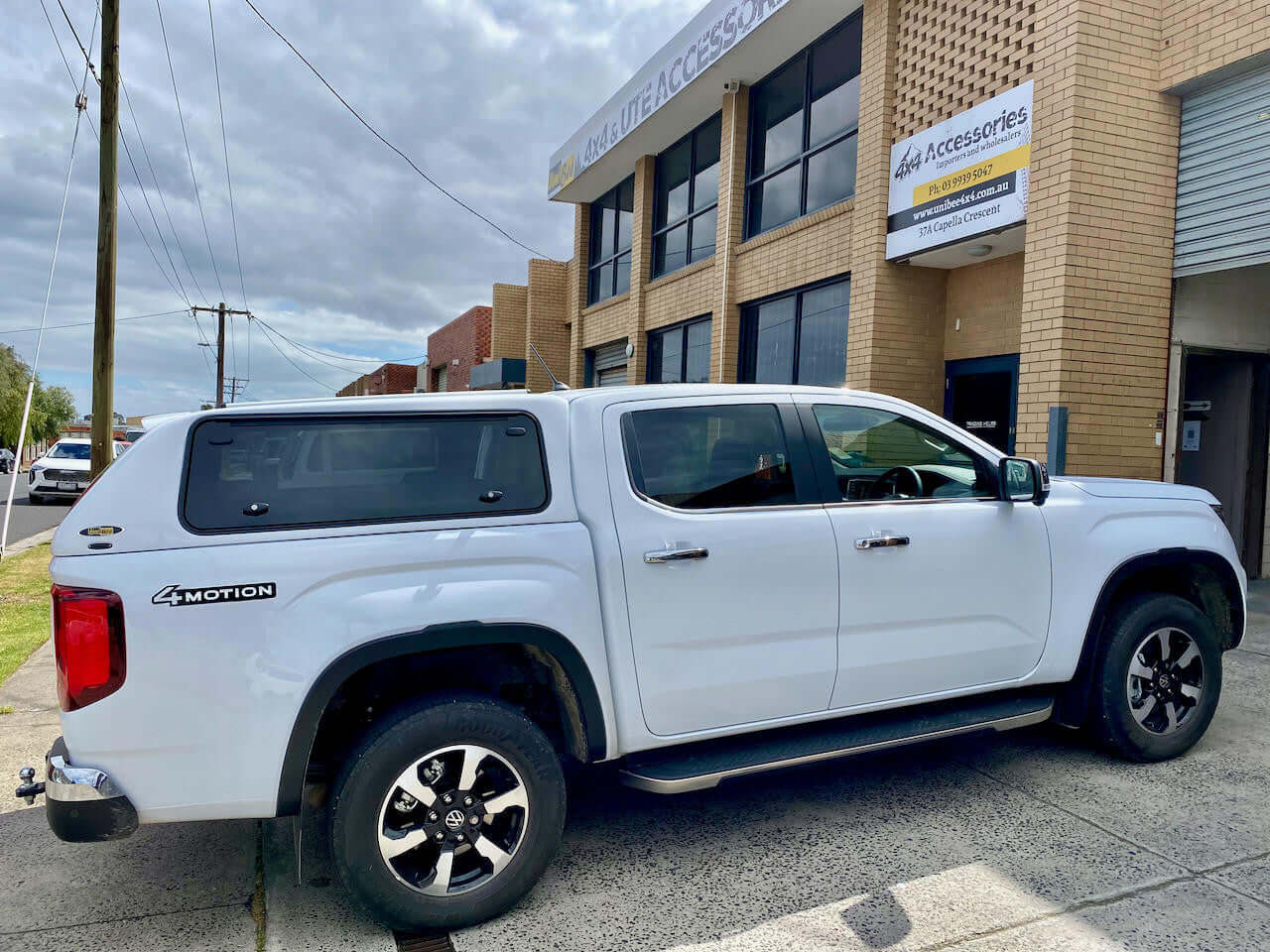 Volkswagen Amarok Canopy in front of accessories shop, showcasing amarok canopy for 2023-2025 models
